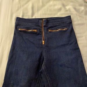 Dark wash skinny jeans with zipper detail